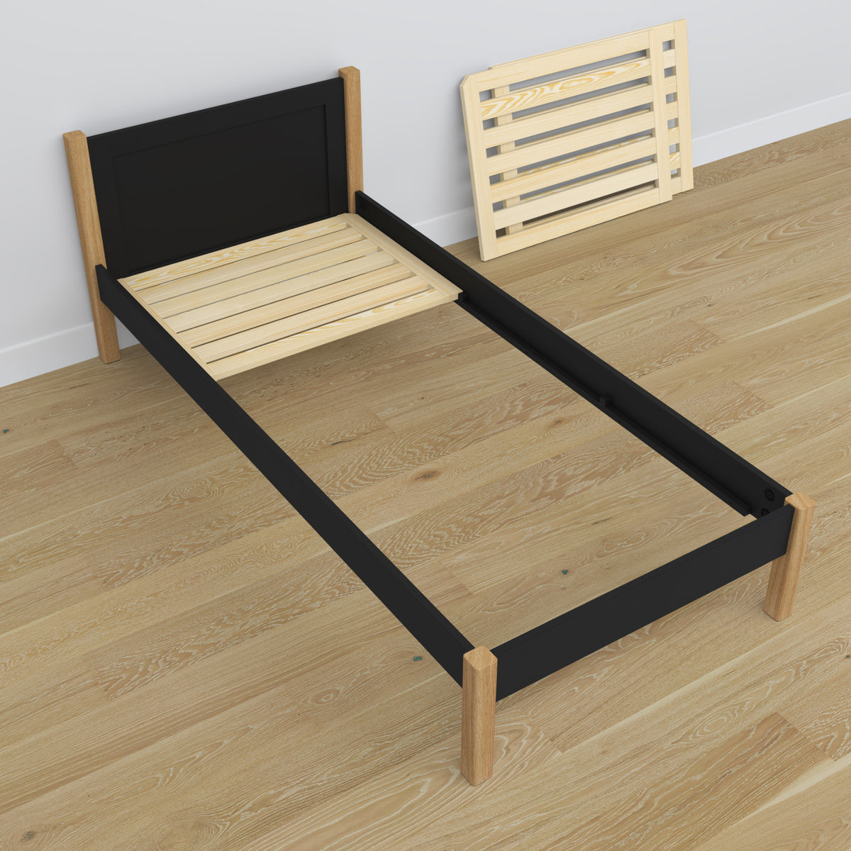 Lit simple en bois noir-chêne – vue en biais, chambre d'enfant scandinave